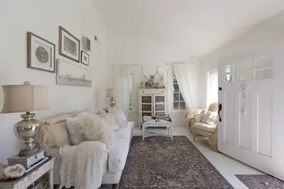 a living room with a white couch and chairs at Elegant White Cottage, Venice Beach, California in Los Angeles