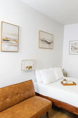 a room with two beds and a couch at Exclusive Suites in MDR-Venice with Pool, GYM & HotTub in Los Angeles
