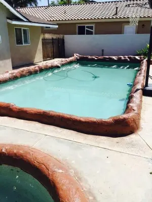 a large pool of water in a backyard at Amazing BBQ POOl home at center of LA\u7f8e\u5f0f\u56db\u623f\u5927\u5730\u6cf3\u6c60\u70e7\u70e4\u533a\u7f8e\u5c4b in Chino Hills