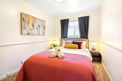 a bedroom with a bed with two stuffed animals on it at Luxury Home - 7mins LAX/Beach, 405/SoFi nearby in Hawthorne