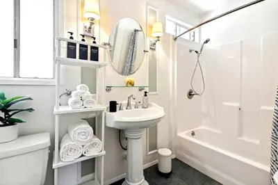 a white bathroom with a sink and a mirror at Luxury Home - 7mins LAX/Beach, 405/SoFi nearby in Hawthorne
