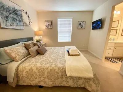 a bedroom with a large bed in a room at Bella's sweet house 11155 in Mira Loma