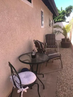 a table and two chairs on a patio at Romantic Coastal Private Room in Oxnard