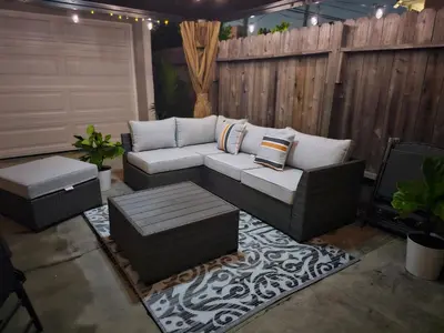 a patio with a couch and a coffee table at The Heart Of LA House in Los Angeles