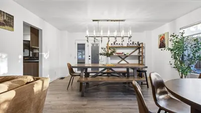 a dining room with a table and a couch at Honeypot by AvantStay Indoor Pool Hot Tub in Big Bear Lake