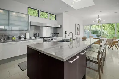 a kitchen with a large island with a counter top at Winding Way in Malibu