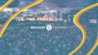 a large crowd of people at a festival at El Nido Beachlife Cottage in South Bay Los Angeles in Redondo Beach