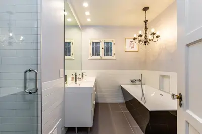 a bathroom with a tub and a sink and a shower at Renovated Spanish 3BD 2BA near Beverly Hills in Los Angeles