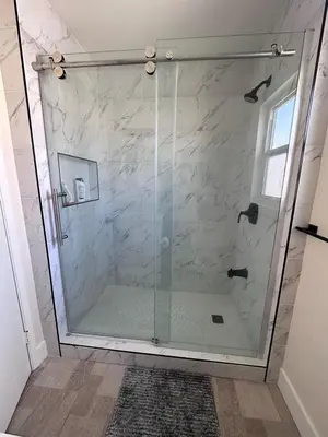 a shower with a glass door in a bathroom at Charming private guest Suite near Disney/Beach in Westminster