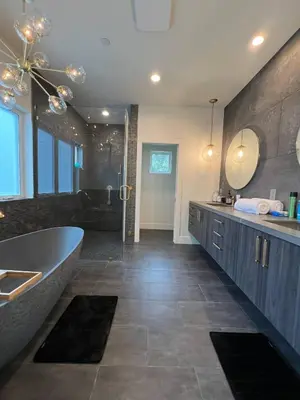 a large bathroom with a tub and a sink at Gorgeous Private and Gated Home in Silver Lake with Pool & Views in Los Angeles