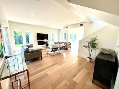 a living room with a couch and a table at Gorgeous Private and Gated Home in Silver Lake with Pool & Views in Los Angeles