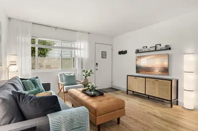 a living room with a couch and a tv at Central Apartment in a Hip Walkable Neighborhood NRP23-01143 in Long Beach