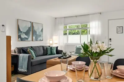 a living room with a table and a couch at Central Apartment in a Hip Walkable Neighborhood NRP23-01143 in Long Beach