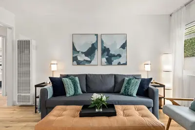 a living room with a couch and a table at Central Apartment in a Hip Walkable Neighborhood NRP23-01143 in Long Beach