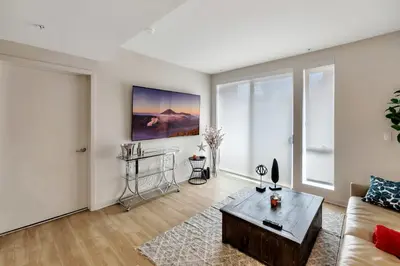 a living room with a couch and a table at 5 Heart of Santa Monica apartment in Los Angeles