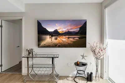 a room with a table and a painting on the wall at 5 Heart of Santa Monica apartment in Los Angeles