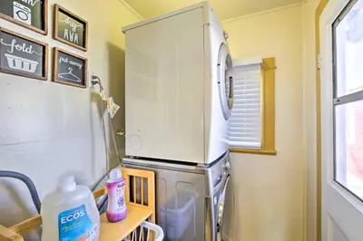 a refrigerator with a microwave on top of it at 7 Mi to Downtown Long Beach Bungalow with Patio! in Long Beach