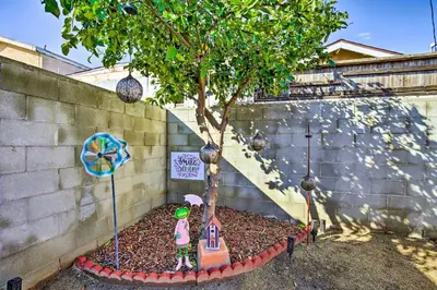 a small tree in a garden with a toy at 7 Mi to Downtown Long Beach Bungalow with Patio! in Long Beach
