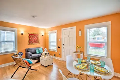 a living room with a table and chairs and a couch at 7 Mi to Downtown Long Beach Bungalow with Patio! in Long Beach