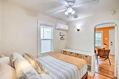 a bedroom with a bed and a ceiling fan at 7 Mi to Downtown Long Beach Bungalow with Patio! in Long Beach