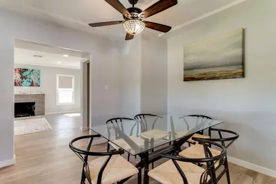 a dining room with a glass table and chairs at San Fernando Pool home + Large Private Guest House in San Fernando