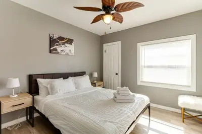a bedroom with a bed and a ceiling fan at San Fernando Pool home + Large Private Guest House in San Fernando