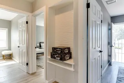 a hallway with a door open to a room with a table at San Fernando Pool home + Large Private Guest House in San Fernando
