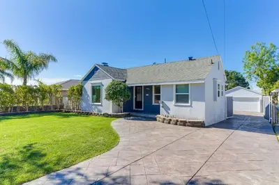 a white house with a yard at San Fernando Pool home + Large Private Guest House in San Fernando