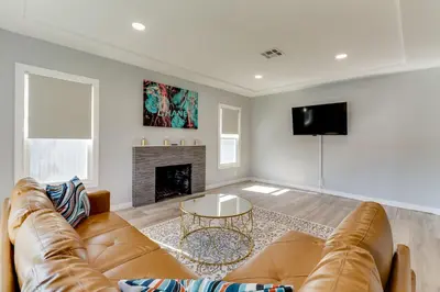 a living room with a couch and a fireplace at San Fernando Pool home + Large Private Guest House in San Fernando