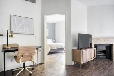 a living room with a desk and a tv and a bedroom at Hollywood 1BR w Gym Pool Spa nr Sunset LAX-55 in Los Angeles
