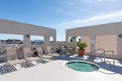 a patio with chairs and a hot tub on a building at Hollywood 1BR w Gym Pool Spa nr Sunset LAX-55 in Los Angeles