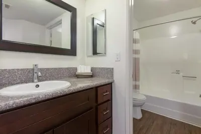 a bathroom with a sink and a toilet and a mirror at Hollywood 1BR w Gym Spa Pool nr Metro LAX-52 in Los Angeles