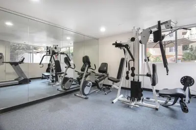 a gym with several treadmills and elliptical machines at Hollywood 1BR w Gym Spa Pool nr Metro LAX-52 in Los Angeles