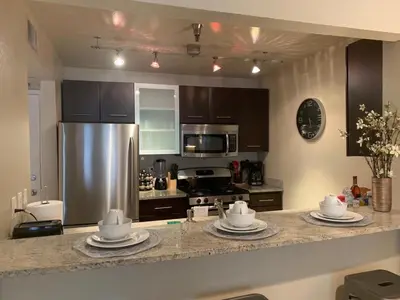 a kitchen with a counter with plates on it at Hollywood loft spectacular free parking in Los Angeles