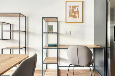 a room with a table and a chair and shelves at Downtown 1BR w Pool Gym WD nr Staples Center LAX-547 in Los Angeles