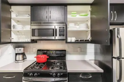 a kitchen with a stove and a microwave at W Hollywood 1BR nr Shops Melrose LAX-210 in Los Angeles