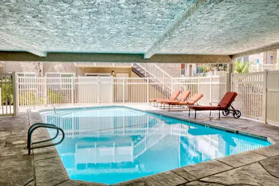 a swimming pool with two chairs and a table at Marina Del Rey 1BR nr marina shops dining LAX-467 in Los Angeles