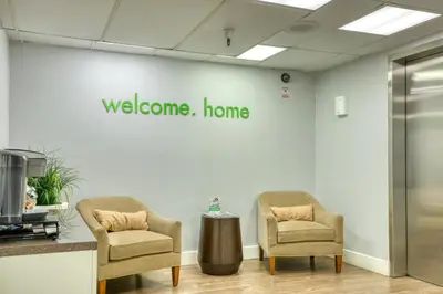 a waiting room with two chairs and a welcome home sign at Pasadena 1BR w Gym Pool nr Colorado Ave LAX-862 in Pasadena