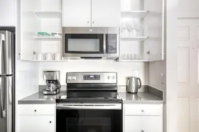 a kitchen with a stove and a microwave at Burbank 1BR w Pool WD Gym nr TJ WF LAX-788 in Los Angeles
