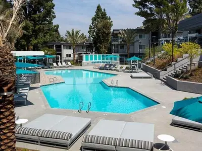 a swimming pool with lounge chairs in a resort at Burbank 1BR w Pool WD Gym nr TJ WF LAX-788 in Los Angeles