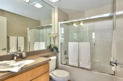a bathroom with a shower and a toilet and a sink at Awesome Top Floor 2-Bedroom with Balcony in Los Angeles