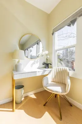 a white chair in a room with a mirror at Cozy Sunny Brand-new Apt 1 Block From The Beach in Long Beach