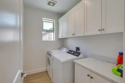 a laundry room with a washing machine and a window at Pet-Friendly Paramount Home, 16 Mi to Los Angeles! in Paramount