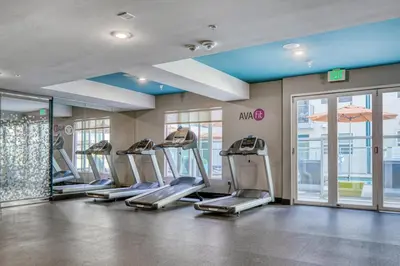 a gym with a row of treadmills in a building at North Hollywood 2BR w Gym Pool nr TJ LAX-880 in Los Angeles
