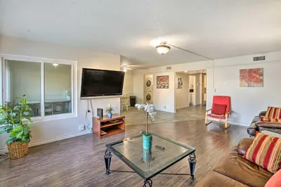 a living room with a couch and a table at 1 Mi to SoFi! Convenient Inglewood Condo in Inglewood