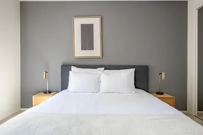 a bedroom with a large white bed with two lamps at Century City 2BR w WD BBQ nr Mall LAX-334 in Los Angeles