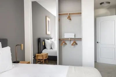 a bedroom with a white bed and a mirror at Century City 2BR w WD BBQ nr Mall LAX-334 in Los Angeles