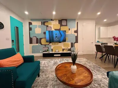 a living room with a couch and a table at Luminousness 4B3B Home in Torrance