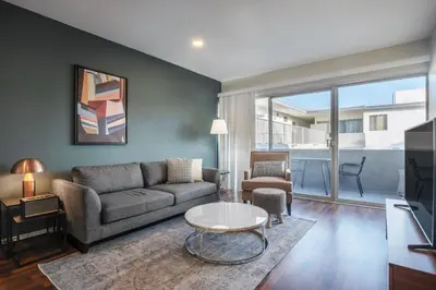 a living room with a couch and a table at Brentwood 1BR w Outdoor Pool nr UCLA Downtown LAX-188 in Los Angeles