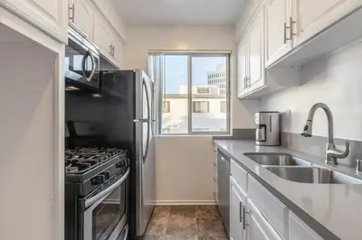 a kitchen with a stove and a sink at Brentwood 1BR w Outdoor Pool nr UCLA Downtown LAX-188 in Los Angeles
